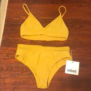 Mimi Kini yellow bathing suit